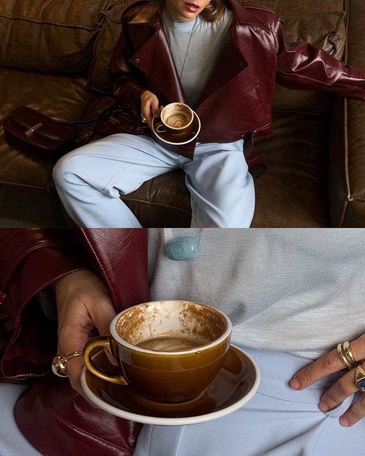 Person in a stylish burgundy jacket holding a latte cup, sitting on a leather couch.