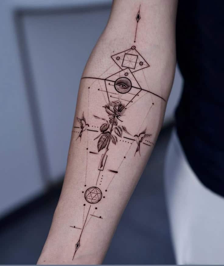 d03d5708c4fac86b5b5461d0dc4b86f9 Geometric forearm tattoo with rose, eye, and hummingbird designs in fine black ink. | Sky Rye Design Geometric forearm tattoo with rose, eye, and hummingbird designs in fine black ink.