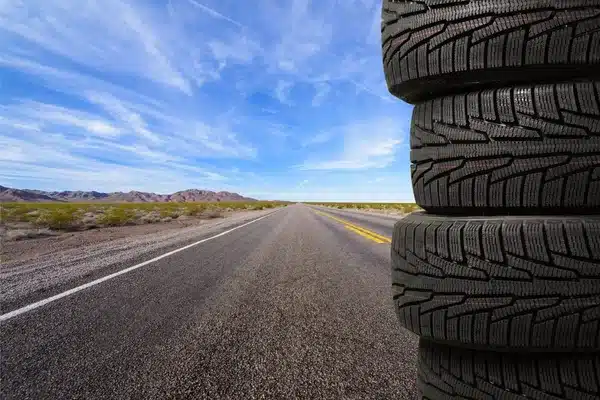 depositphotos_113664864-stock-photo-tires-objects-isolated Stack of new car tires beside an open desert highway under a clear blue sky, ideal for road trip safety and performance. | Sky Rye Design Stack of new car tires beside an open desert highway under a clear blue sky, ideal for road trip safety and performance.
