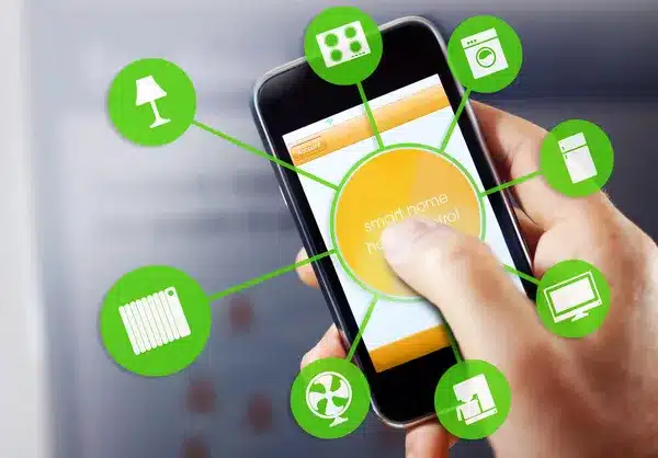 User controlling smart home devices via mobile app interface on smartphone, showcasing connected technology.