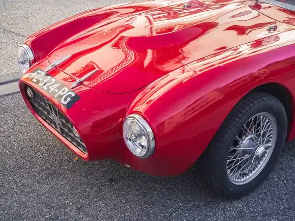 depositphotos_609097650-stock-photo-loriol-sur-drome-france-september Vintage red sports car with wire wheels and classic design, parked on a sunny street. | Sky Rye Design Vintage red sports car with wire wheels and classic design, parked on a sunny street.
