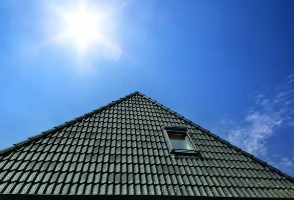 depositphotos_664383010-stock-photo-open-roof-window-velux-style Sloped roof with tiles under a bright sun and blue sky, featuring one small window. | Sky Rye Design Sloped roof with tiles under a bright sun and blue sky, featuring one small window.