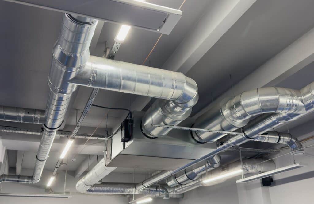 Industrial ceiling with metal HVAC ducts for efficient air circulation.