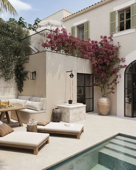 Mediterranean-style patio with pool, lounge chairs, flowering bougainvillea, and a cozy seating area.