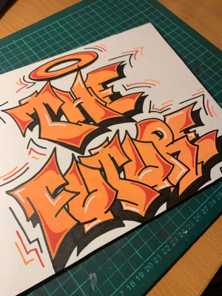 fbf94570003c2e610bc9661e0fc4282e Graffiti-style artwork on a desk, featuring the words The Future in bold, vibrant colors on a cutting mat. | Sky Rye Design Graffiti-style artwork on a desk, featuring the words The Future in bold, vibrant colors on a cutting mat.