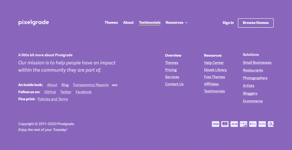 Website footer with Pixelgrade’s mission, links to themes, testimonials, resources, and contact information on a purple background.