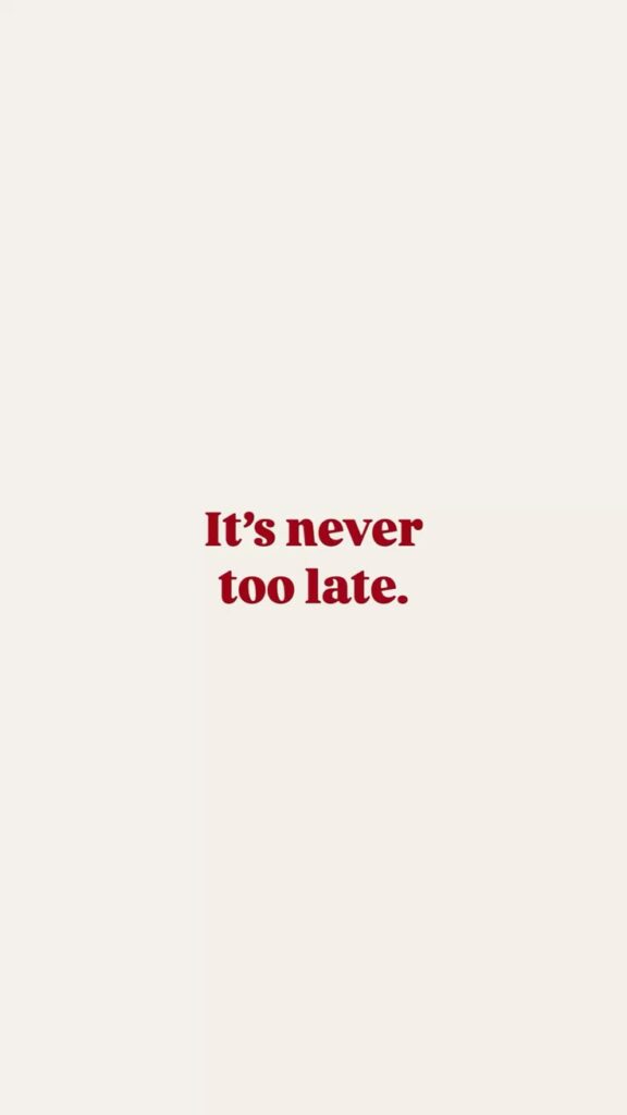 Inspirational quote in red text: “It’s never too late” on a cream background. Positive message emphasizing opportunity.