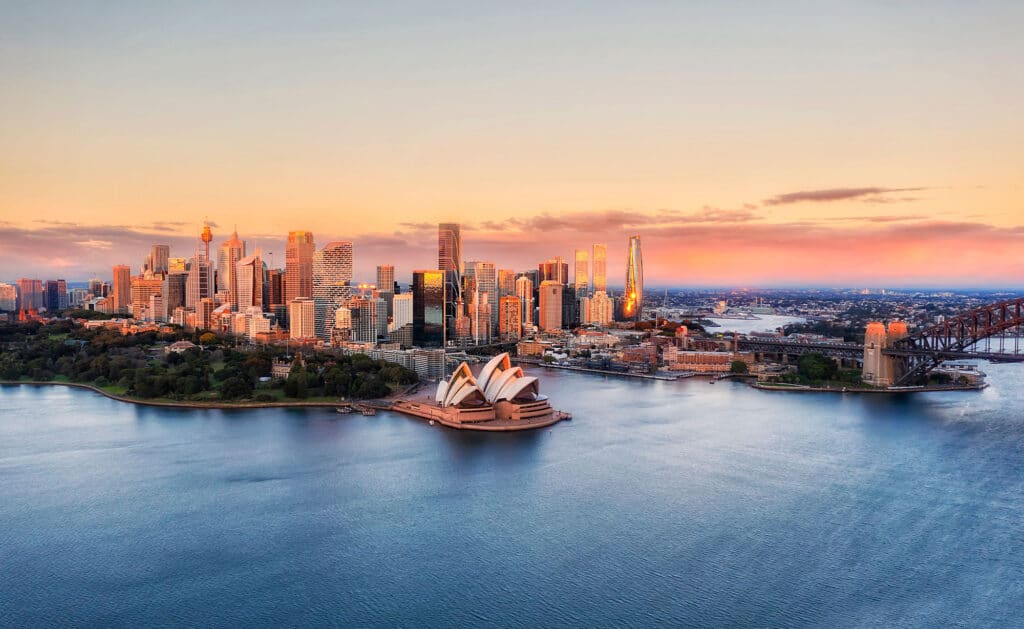 mortgage-broker-sydney3 Aerial view of Sydney Opera House and city skyline at sunset, with Sydney Harbour Bridge to the right, Australia. | Sky Rye Design Aerial view of Sydney Opera House and city skyline at sunset, with Sydney Harbour Bridge to the right, Australia.