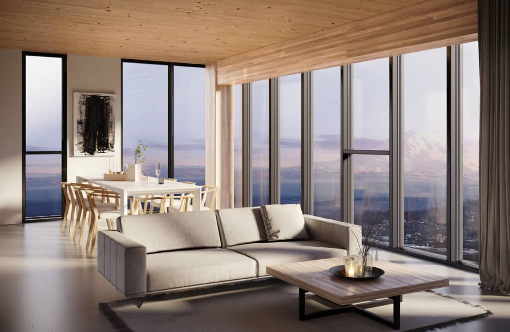 Modern living room with mountain view, large windows, beige sofa, wooden dining table, and stylish decor.