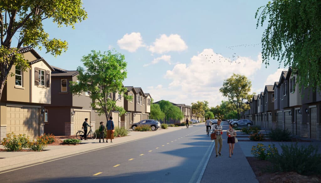 Modern suburban street with townhouses, people walking and cycling, trees, and parked cars on a sunny day.