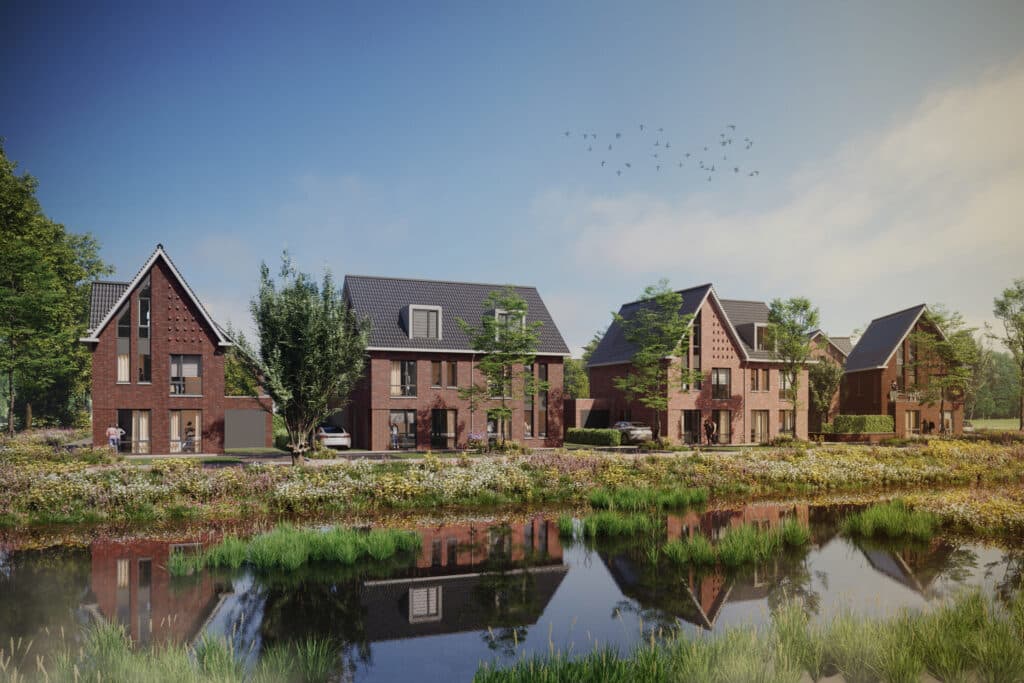 Scenic view of modern brick houses by a tranquil pond, surrounded by lush greenery under a clear blue sky.