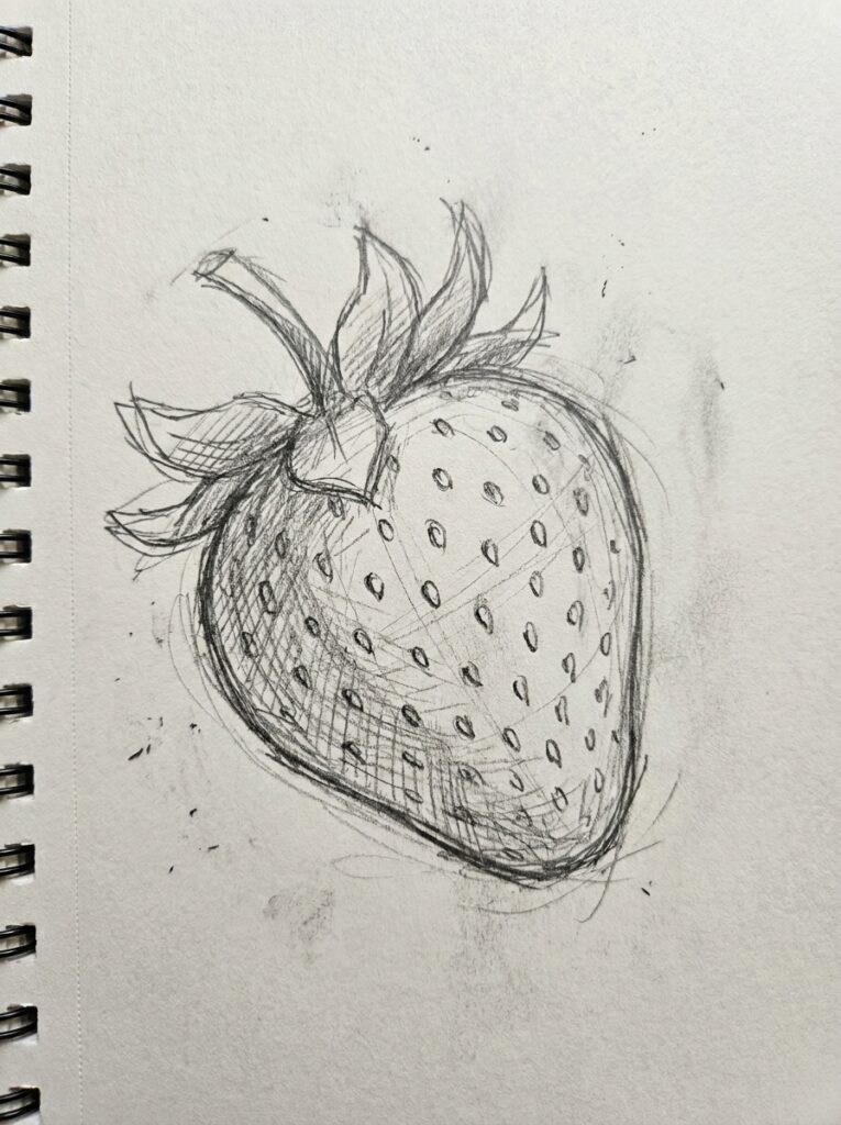 Hand-drawn pencil sketch of a strawberry with seeds and leaves on a spiral-bound sketchbook page