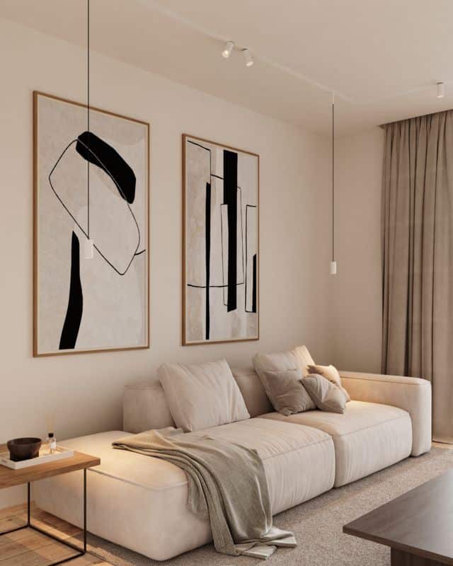 Modern living room with beige sofa, abstract art, and neutral tones. Cozy and minimalist interior design.