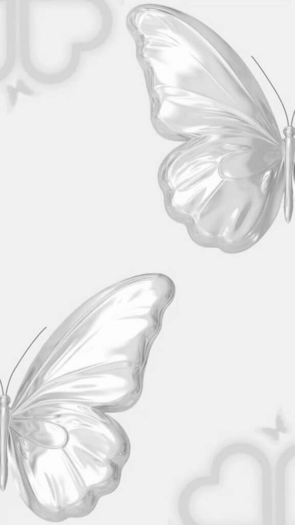 Silver metallic butterflies on a gray background, creating a sleek, minimalist design.