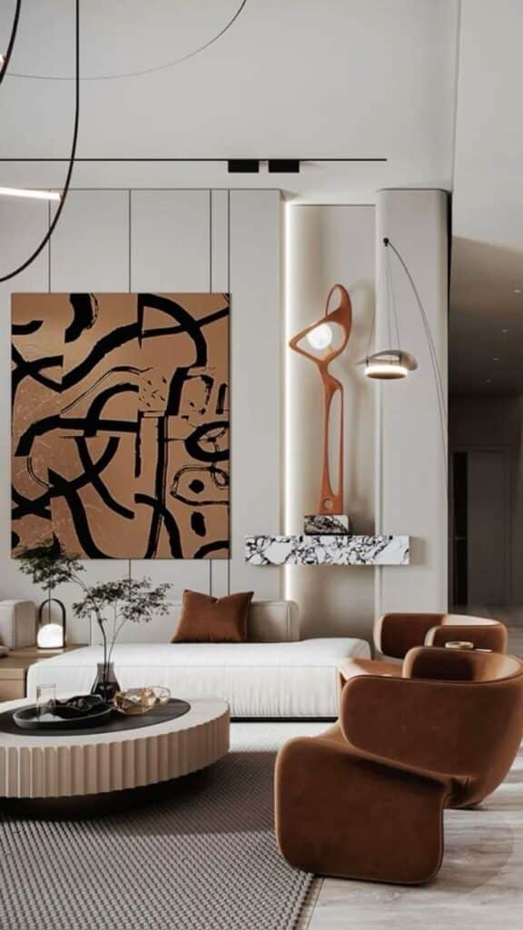075addfe-9027-4df8-b195-9de850335424 Modern living room with abstract art, brown chairs, and marble accents, creating a stylish and cozy ambiance. | Sky Rye Design Modern living room with abstract art, brown chairs, and marble accents, creating a stylish and cozy ambiance.