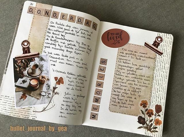 Bullet journal open to a page with decorative text, fall-themed designs, and a cozy autumn photo.