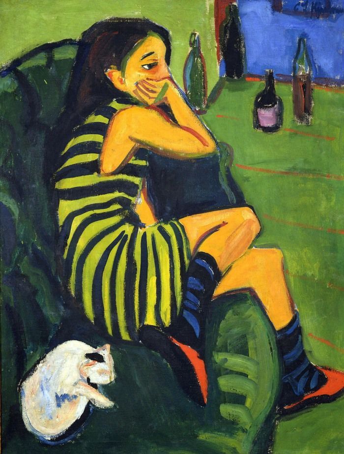 Painting of a woman in a striped dress sitting pensively on a green sofa with a white cat nearby.