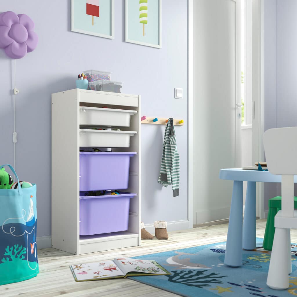 Child's room with colorful storage bins, blue play table, decorative art, and playful rug for a vibrant, organized space.