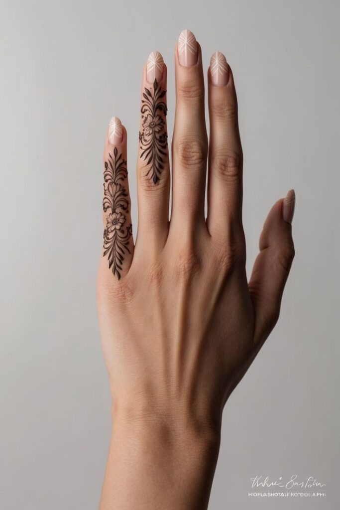 Hand with floral henna design and geometric nail art on a neutral background.