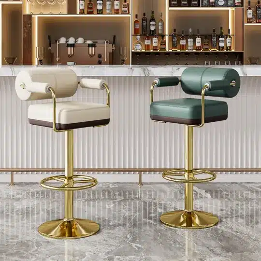 Luxurious bar stools with gold bases in modern bar setting, featuring plush white and green seating.