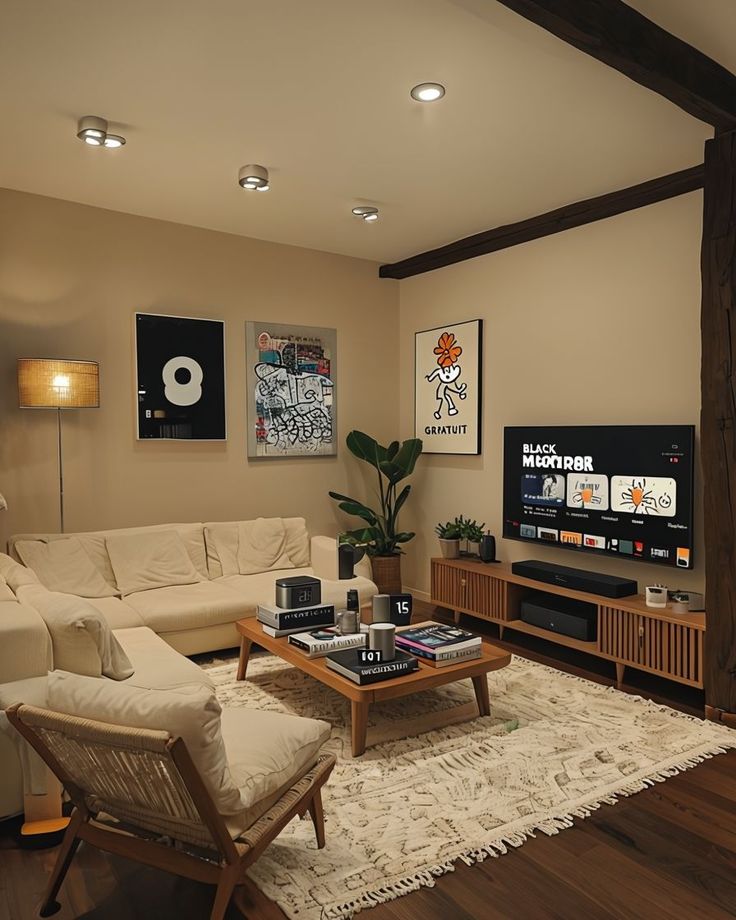 Modern living room with cozy beige sofas, a TV stand, and stylish wall art.