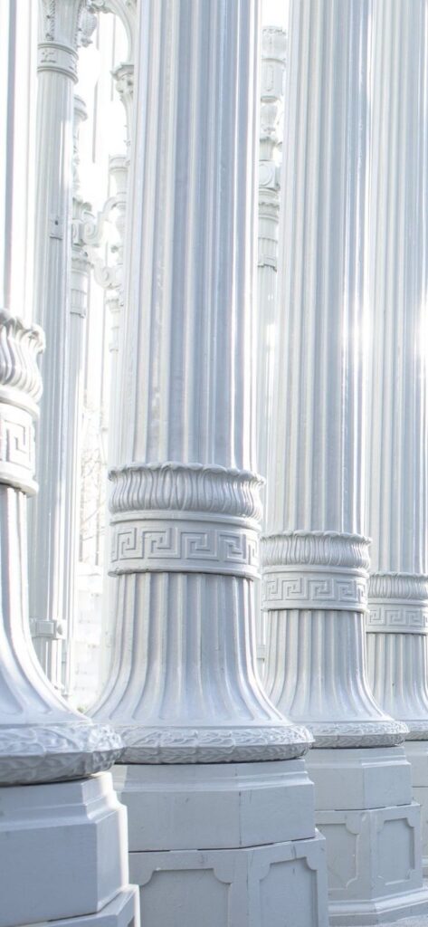 1b63336a5da38f88ada1907455ec4f7e Row of ornate white columns with intricate details under sunlight. Perfect example of classical architecture design. | Sky Rye Design Row of ornate white columns with intricate details under sunlight. Perfect example of classical architecture design.