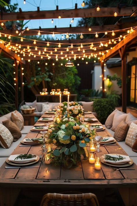 1c8e0687-999f-40f3-a82d-3cc5f012a220 Outdoor dining table setting with string lights, candles, and floral centerpiece, creating a cozy evening ambiance. | Sky Rye Design Outdoor dining table setting with string lights, candles, and floral centerpiece, creating a cozy evening ambiance.