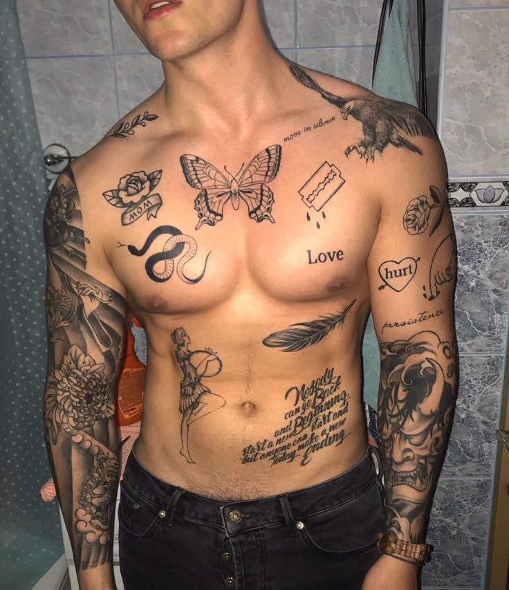 Man with arm and chest tattoos including a butterfly, feather, and various quotes.