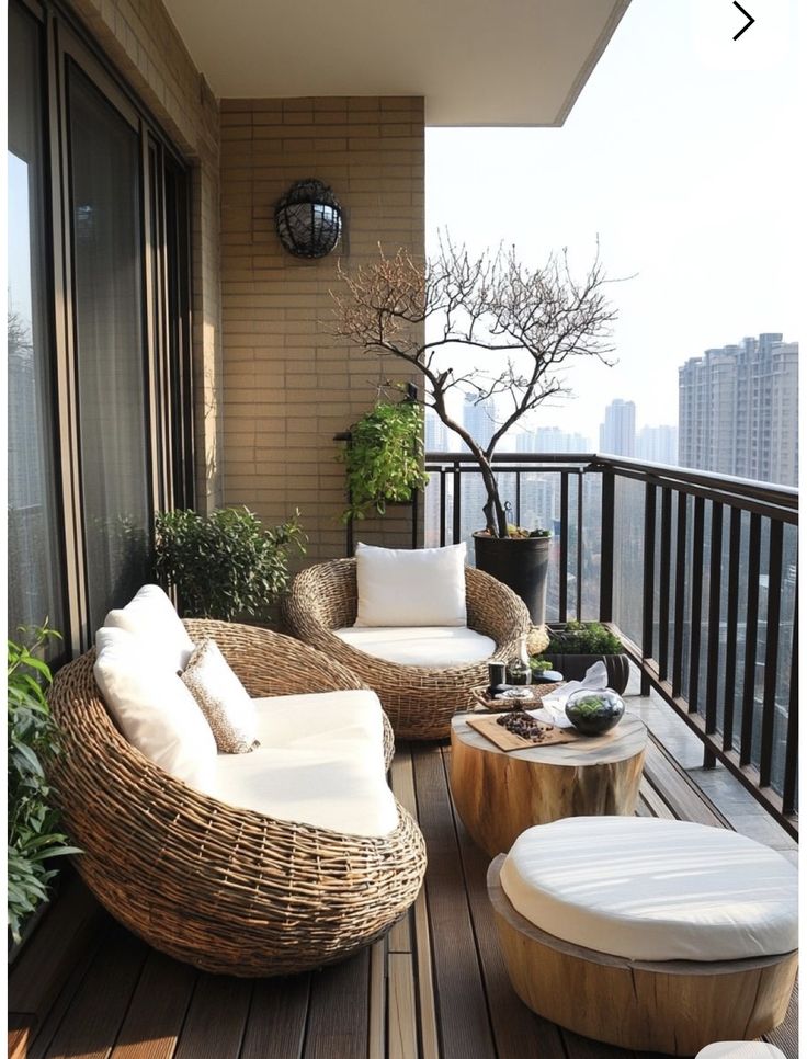 Screenshot Cozy modern balcony with wicker furniture, round cushions, and city view; perfect for relaxation and outdoor living. | Sky Rye Design Cozy modern balcony with wicker furniture, round cushions, and city view; perfect for relaxation and outdoor living.