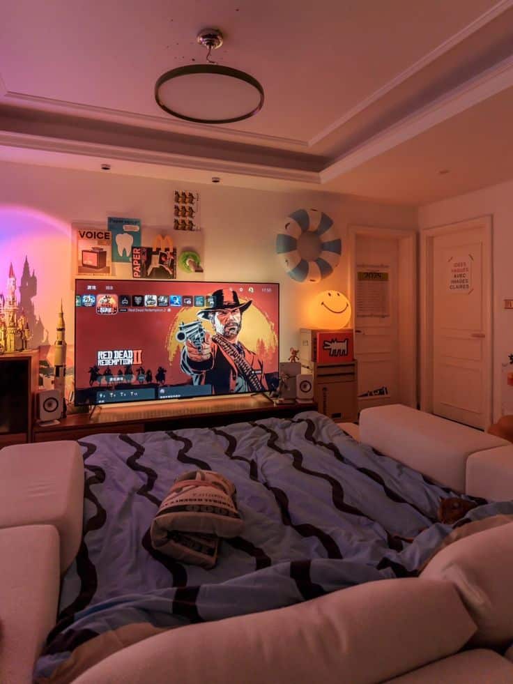 Cozy gaming setup with a large TV displaying Red Dead Redemption II, surrounded by modern decor and soft lighting.