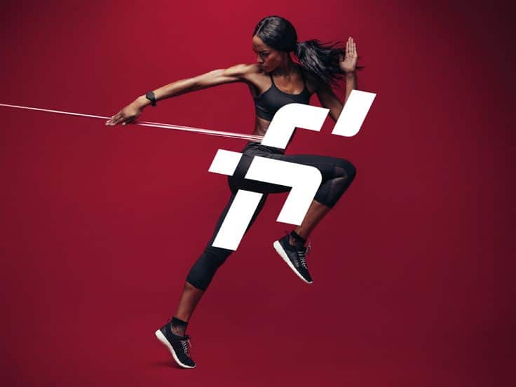 Athletic woman jumping in stylish activewear against a vibrant red background with dynamic design elements.