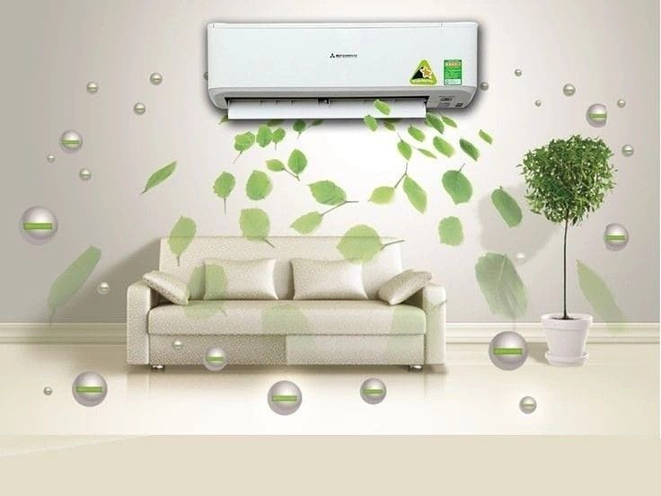 Modern air conditioner in living room with green leaves depicting fresh air flow.