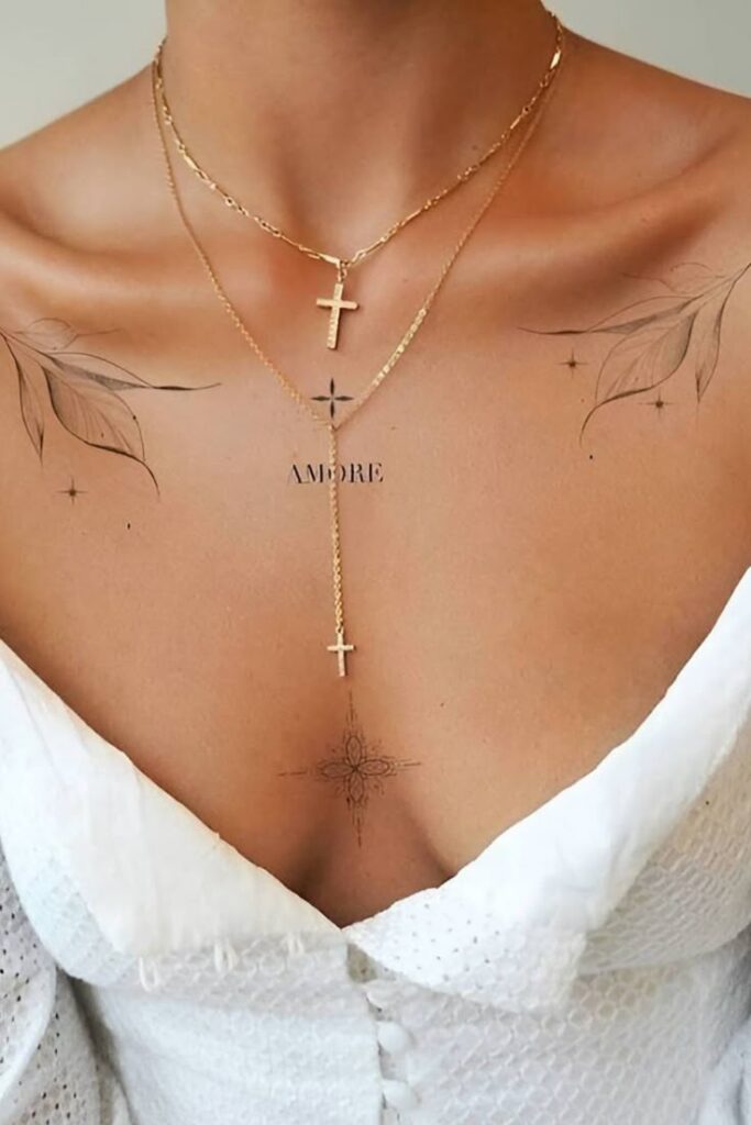 Elegant gold cross necklace and tattoos on chest with white top.