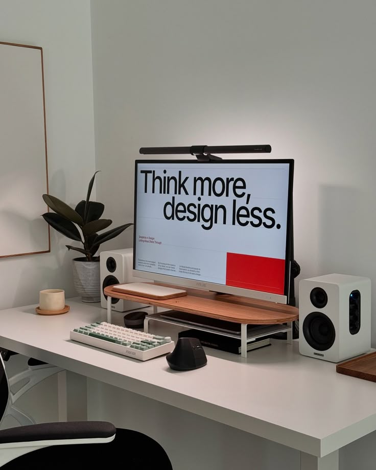 _ 27 Minimalist workspace with monitor displaying Think more, design less. Features keyboard, mouse, speaker, and potted plant. | Sky Rye Design Minimalist workspace with monitor displaying Think more, design less. Features keyboard, mouse, speaker, and potted plant.