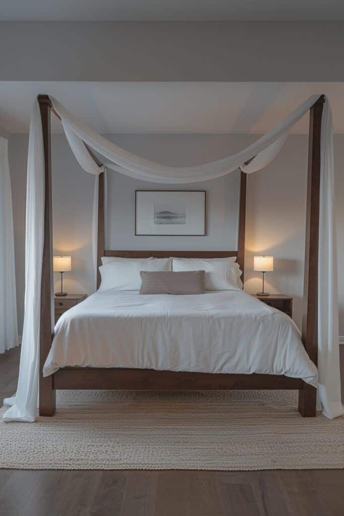 Elegant bedroom with a canopy bed, white linens, cozy lighting, and minimalist decor.