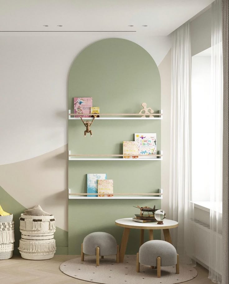 Modern kids' room with pale green wall, decorative shelves, small table, chairs, and storage baskets for toys.