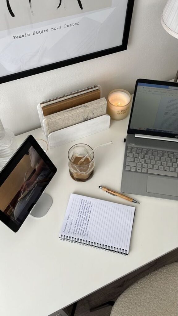 3cb5a8a5-c9bf-43c3-a730-d8b6adc43622 Workspace with laptop, tablet, notebook, coffee, and candle on a clean white desk. | Sky Rye Design Workspace with laptop, tablet, notebook, coffee, and candle on a clean white desk.