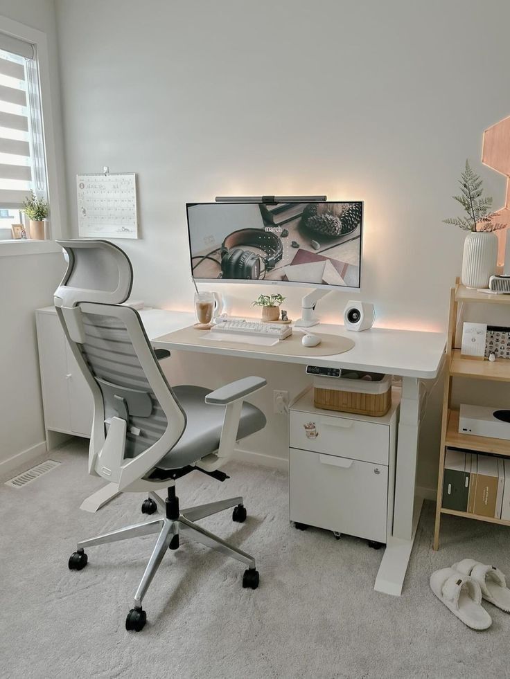 43f4e1d8-8544-4207-8020-7d34ba0a57ae Minimalist home office setup with ergonomic chair, monitor, and clean desk in a bright, modern room. | Sky Rye Design Minimalist home office setup with ergonomic chair, monitor, and clean desk in a bright, modern room.