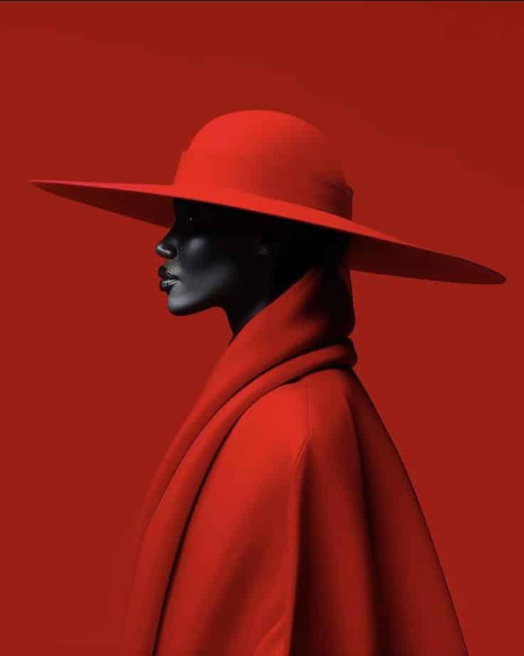 Silhouette of a person in a wide-brimmed red hat and coat against a red background. Fashion and elegance concept.