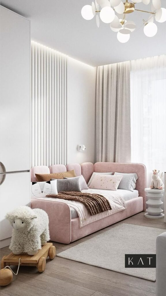 Elegant kids' room with pink bed, plush toys, modern lighting, and cozy decor. Perfect for a stylish and comfy space.