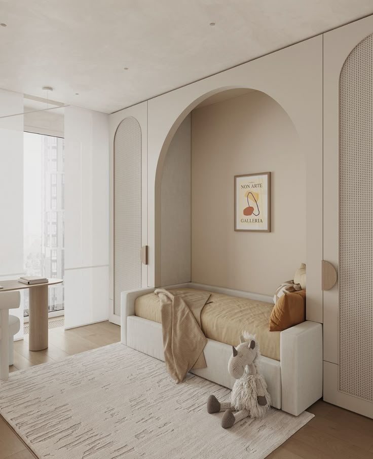 Modern kids bedroom with beige tones, plush toy, minimalist bed, arch accent, and large window for natural light.