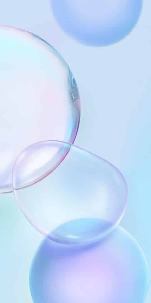 Abstract pastel bubbles floating on a light blue background, creating a calming and dreamy atmosphere.