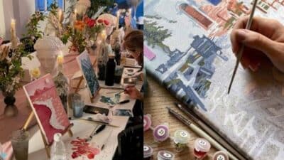 People painting at an art workshop, focusing on brush details and colorful canvases surrounded by decor and flowers.