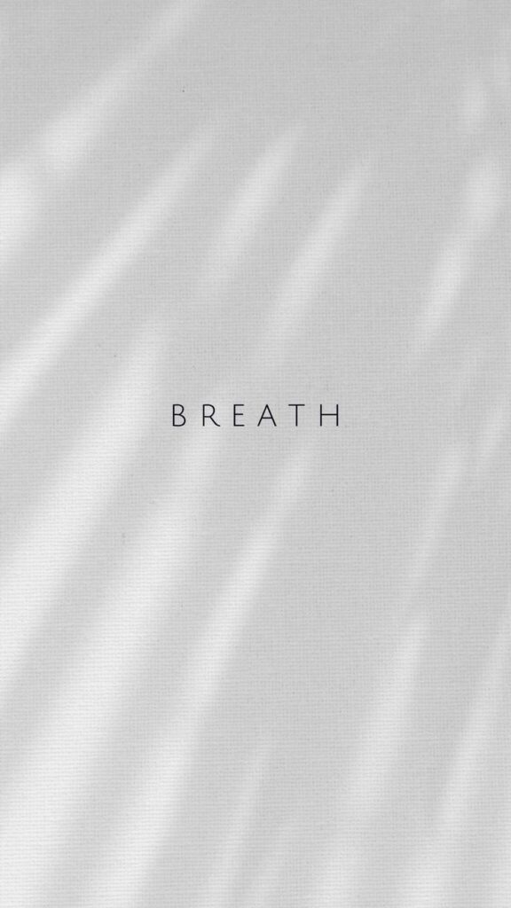 Minimalist design with the word Breath centered on a light textured background, evoking calm and mindfulness.