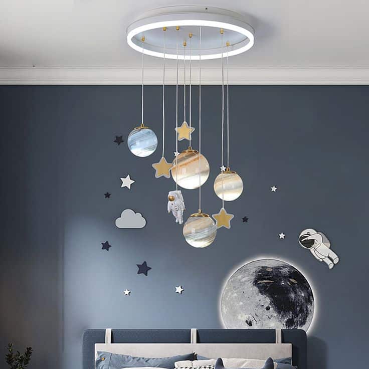 Modern space-themed children's room decor with planet and astronaut ceiling light fixture.