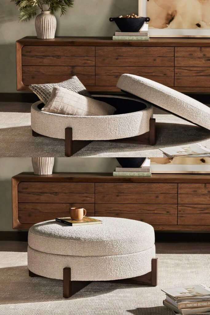 Round ottoman with wooden legs, featuring removable top for storage. Neutral decor with books and plant on the wooden console.