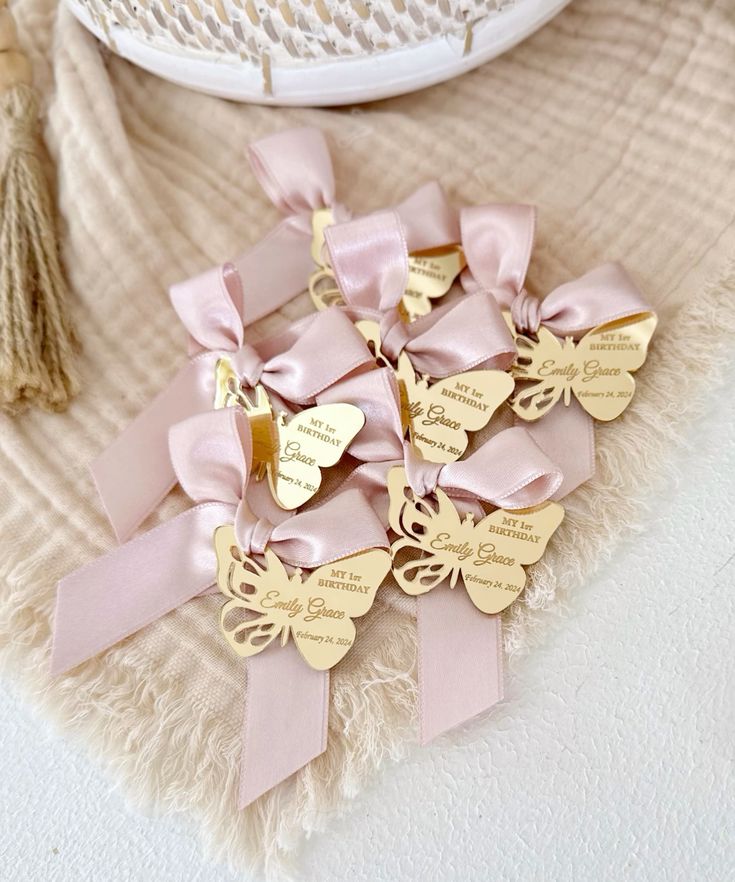 Elegant butterfly-themed party favors with pink ribbons, perfect for birthdays and special events.