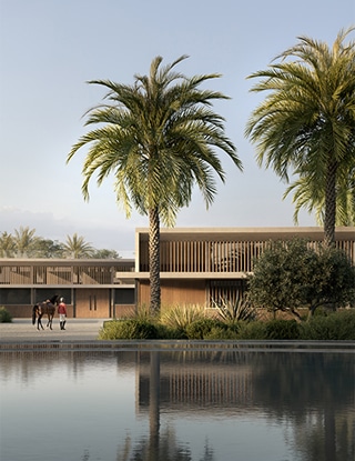 Modern building with palm trees reflected in serene water, people walking nearby under a clear blue sky.
