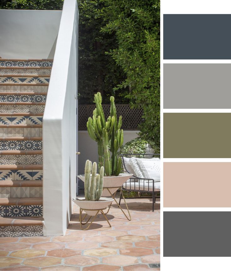 Outdoor staircase with decorative tiles, cacti, and earthy tone palette.
