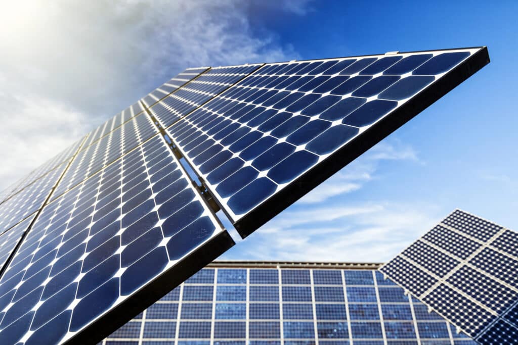 Close-up of solar panels against a blue sky, capturing clean energy.